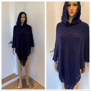 Hooded poncho, blue and black colors available.